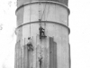 large-concrete-chimney-zoomed-in-at-the-top-of-chimney-with-5-workers