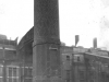 railyard-brick-chimney-front-view-with-rail-wagons-in-foreground