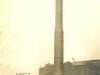tall-concrete-chimney-in-factory-yard
