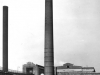 two-chimneys-1-brick-at-base-of-brick-chimney-is-old-vehicle-with-viaduct-coal-heaps