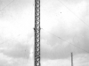 two-tall-metal-masts-in-a-field