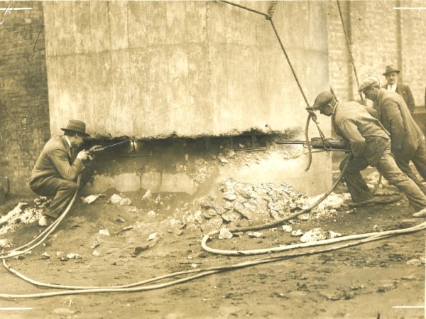 4-workers-drilling-at-base-of-structure