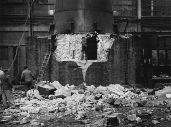 demolition-of-brickwork-at-base-of-metal-chimney-with-6-workers