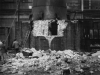demolition-of-brickwork-at-base-of-metal-chimney-with-6-workers